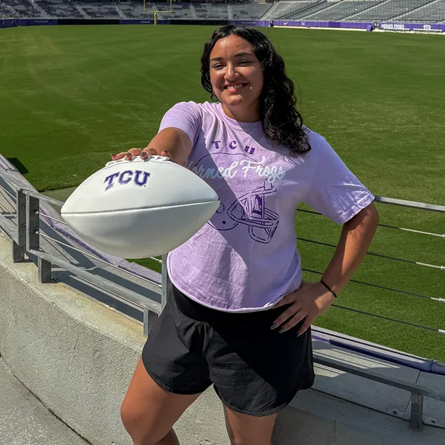 young woman holding a football